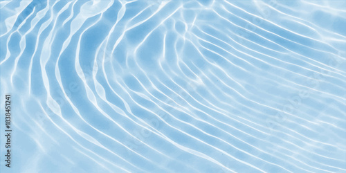 Abstract blue sea waves, ripples, and surface texture create a clean, cool ocean water background pattern for summer reflection and light