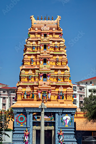 Colorful gopuram of Sri Guruvayur Krishna temple with nice blue sky background in Yeshwantpur, Bangalore India