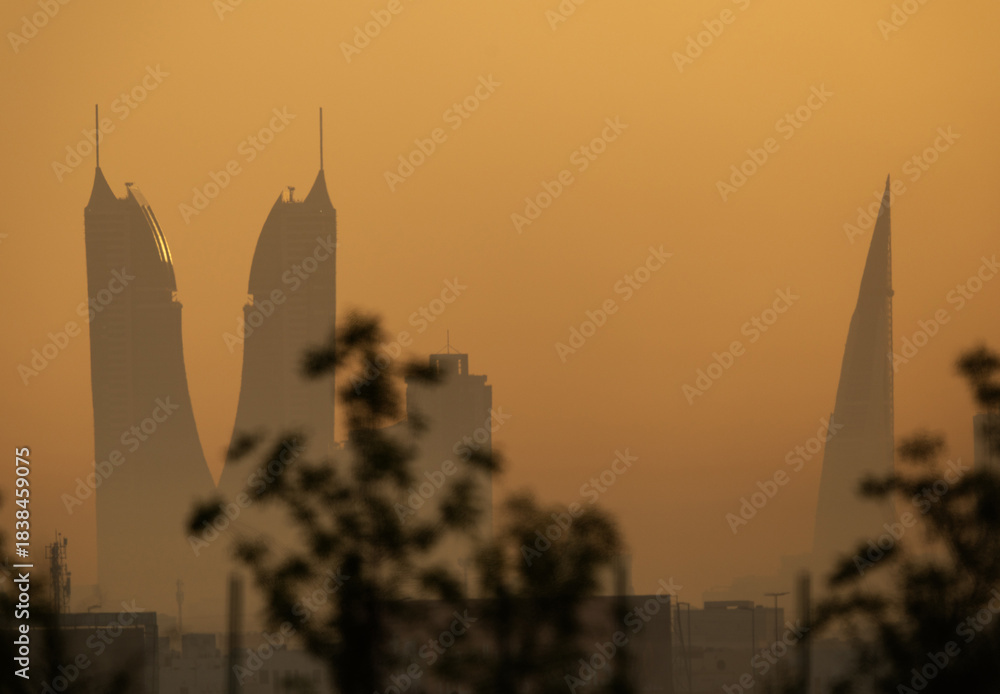 Fototapeta premium Silhouette of Iconic buildings of Bahrain during sunrise.