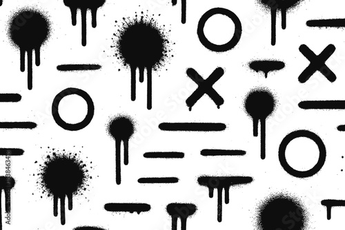 Black spray paint designs on white surface show various symbols and patterns commonly used in street art