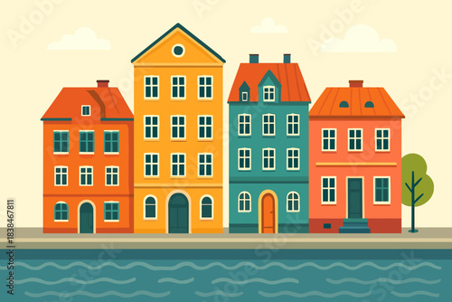 Colorful buildings alongside a river with a tree in a simple urban setting during daytime