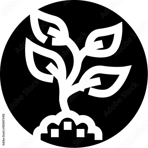 Plant seedling growing from soil in black circle