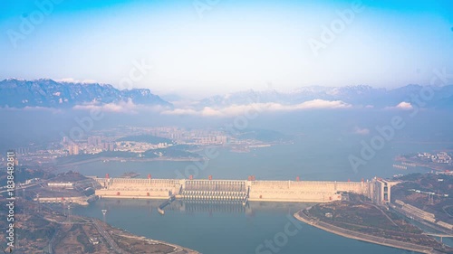Three Gorges Dam Aerial View with Mountains and City Landscape in Cloudy Weather