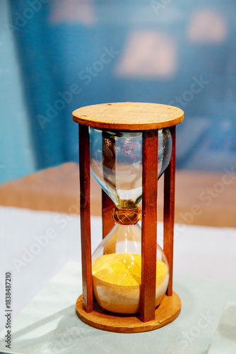 Antique hourglass glass clock isolated on a light background. Items watches antiques technologies World tourism.