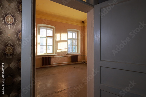 empty room with a window. view through opened door