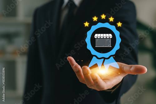 Businessman holding an award badge with a storefront icon and five gold stars symbolizing a quality assurance certificate best store review or excellent customer service