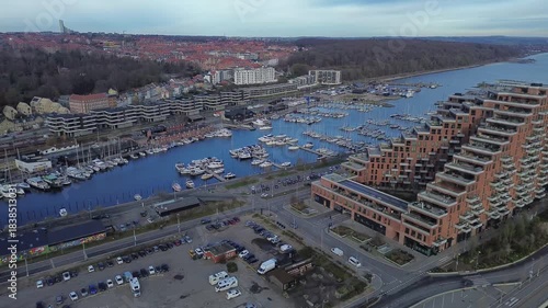 Aerial video of modern marina and terraced waterfront architecture in Aarhus Ø, Denmark