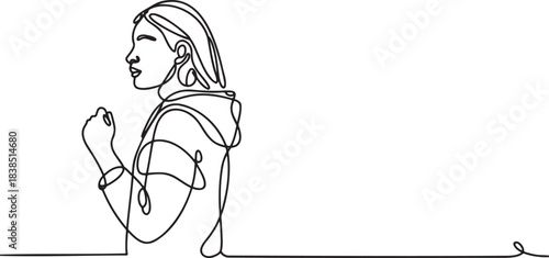 Side profile of woman making fist with determination and focus