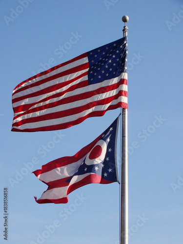 American flag and Ohio State flag on pole
