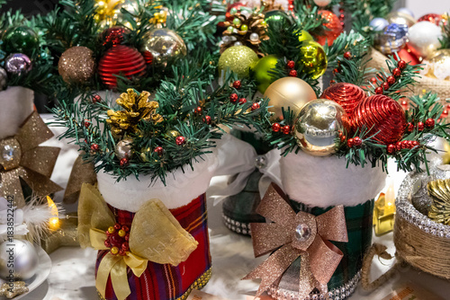 Sparkling colorful Christmas ornaments on table interior