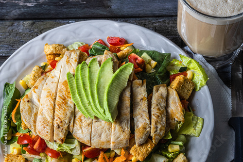 Special house salad with roast chicken.