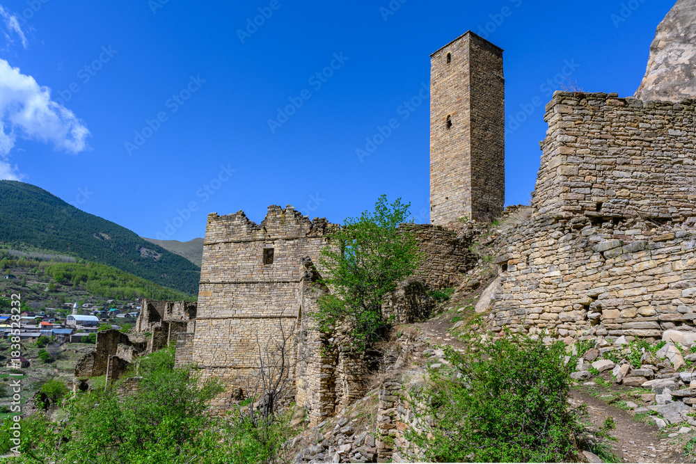 Fototapeta premium Ancient Medieval Stone Tower Ruins in a Mountainous Landscape