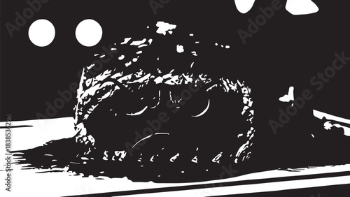 Close up of a dark rustic bread roll on a plate with dramatic high contrast lighting.