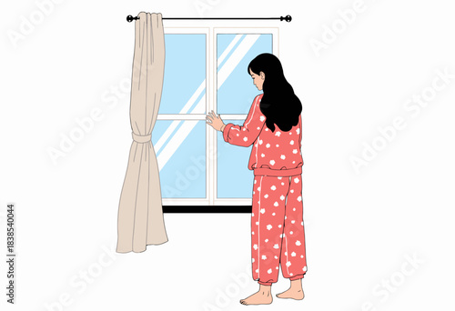 Young woman in polka dot pajamas gazing out a window with open curtains, capturing a moment of reflection and tranquility in a cozy indoor setting