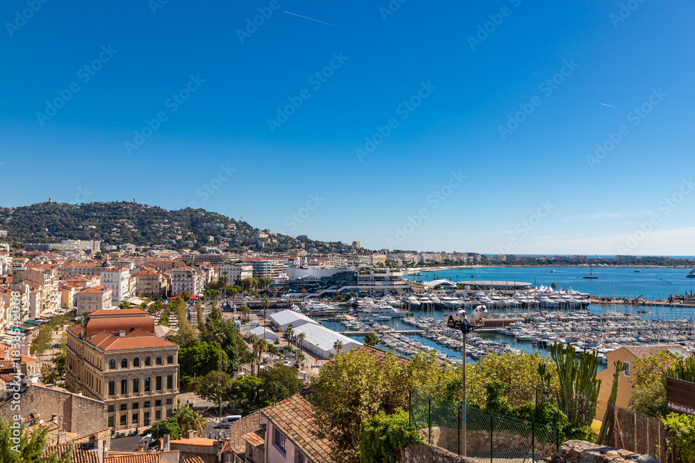Obraz premium Aerial view of old european city on Cote d'azur seashore on sunny day, Cannes, France