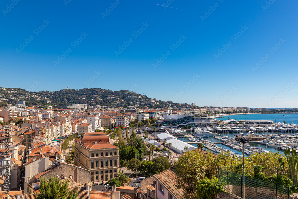 Obraz premium Aerial view of old european city on Cote d'azur seashore on sunny day, Cannes, France
