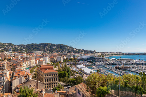Aerial view of old european city on Cote d'azur seashore on sunny day, Cannes, France