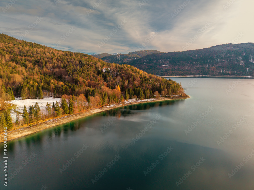 Fototapeta premium A golden hour view to the Walchensee at the lake region of Bavaria during winter season