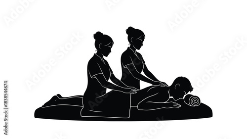 Silhouette of two spa therapists providing a relaxing massage to a client on a mat