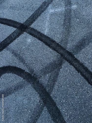 tire rubber on asphalt road texture, no person