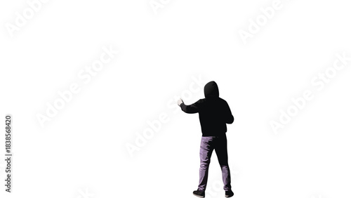 Silhouette of a Person in a Hoodie and Jeans Pointing a Finger in the Dark with Dramatic Lighting