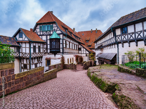 Medieval interior courtyard of Wartburg Castle with half-timbered facades, Germany