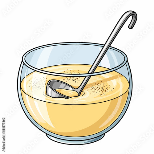 Spoon in Glass of Yellow Milk with Granulated Topping
