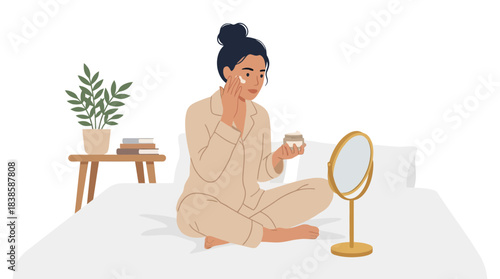 Contemplative woman applying makeup in a cozy bedroom setting with minimal background details and a calm atmosphere