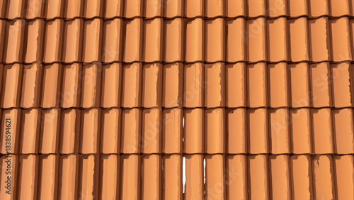 Close Up Of Traditional Terracotta Roof Tiles Showing Texture And Pattern On A Sunny Day With Shadows