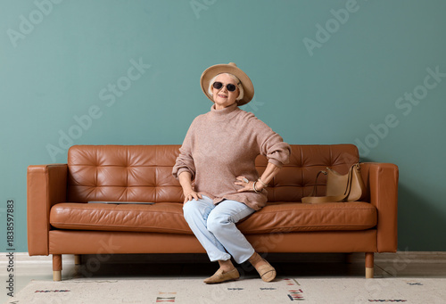Senior woman in stylish hat...