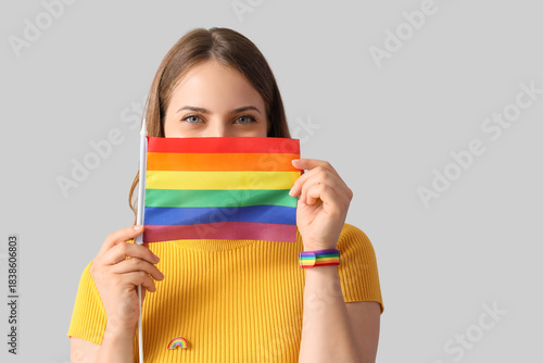Young woman with LGBT flag ...