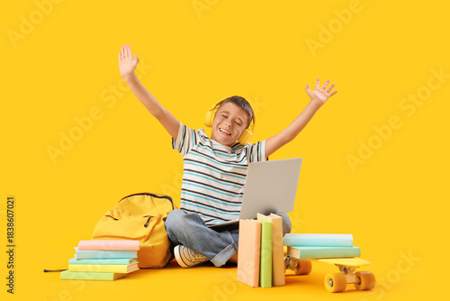 Little boy in headphones wi...