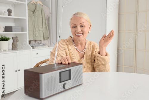 Senior woman with radio rec...