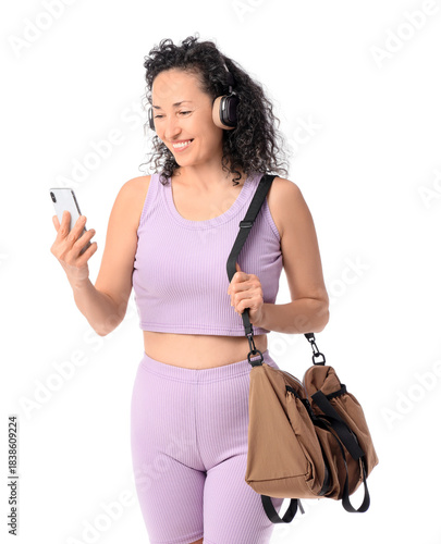 Mature woman in headphones ...