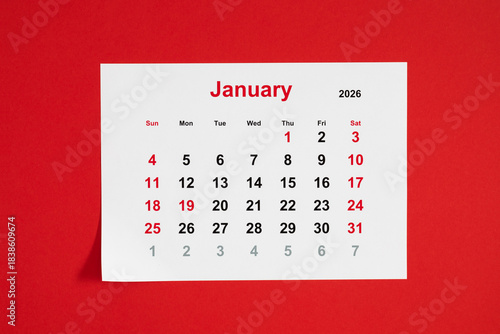 January 2026 Calendar on a Red Background. Calendar sheet for January 2026, located on a bright red background. Clear print and weekends highlighted in red. Ideal for planning and organizing time.