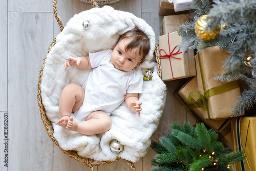 Cute little baby lying in b...