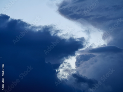 Obraz na plátne Time-lapse footage of menacing deep blue storm clouds gathering in the dark sky