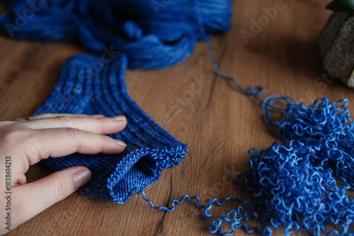 Hand of the girl with knitting needles