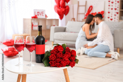 Glasses of wine with roses ...