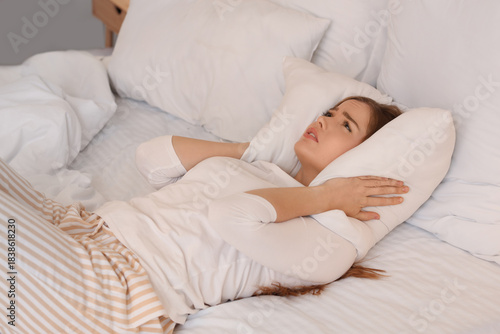 Young woman with pillow suf...