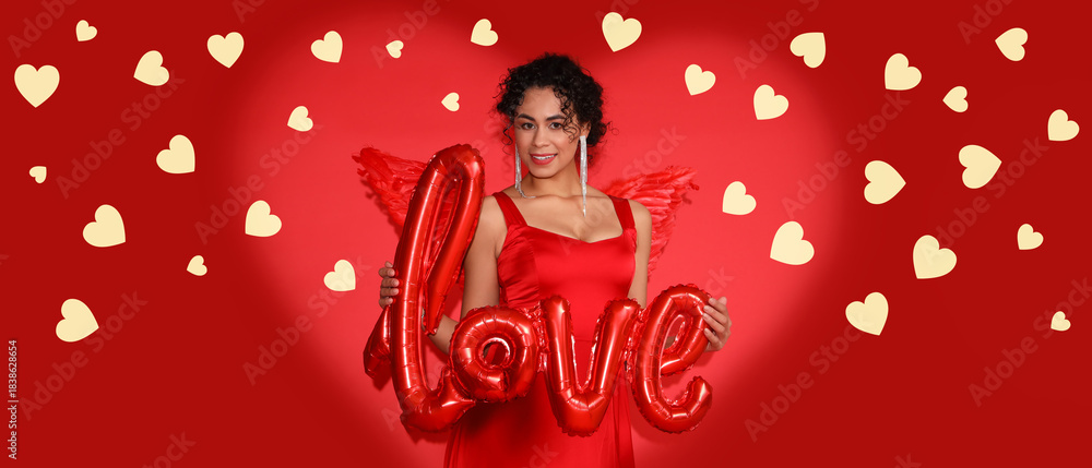 Naklejka premium Young African-American woman dressed as Cupid with word LOVE made of balloons on red background. Valentine's Day celebration