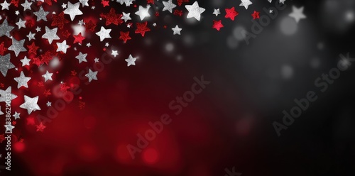 Festive red and silver stars decoration with bokeh effect against dark background.