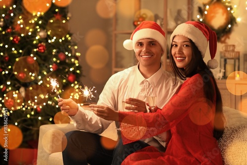 Happy young couple with cha...