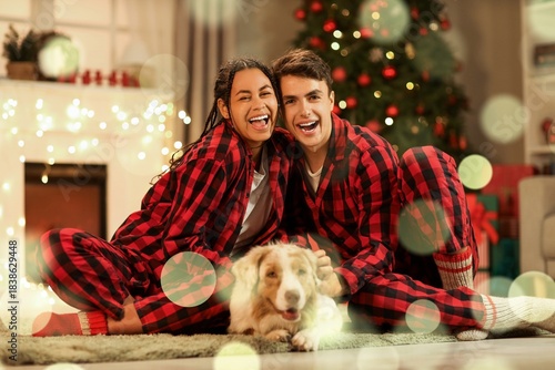 Happy young couple in pajam...