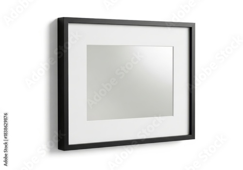 Minimalist black picture frame with white matting displayed on a clean white wall