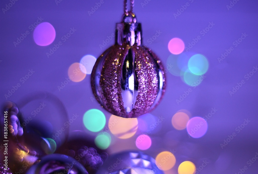Fototapeta premium Christmas and New Year balls decor for tree and human hand beautiful festive background