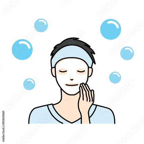 Man applying a sheet mask and touching his face during a relaxing routine