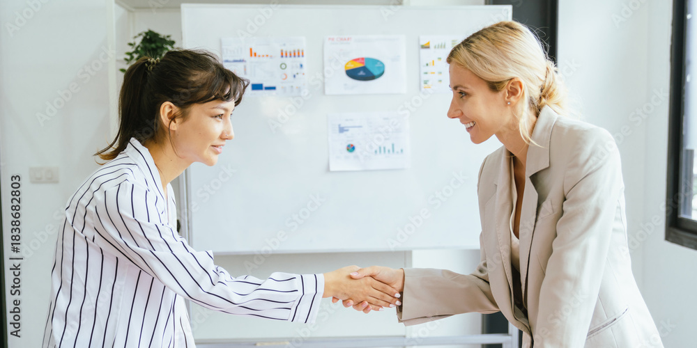 Obraz premium Business team showing unity success with hands together in office, teamwork collaboration and power motivation, diverse colleagues celebrating achievement corporate goal partnership