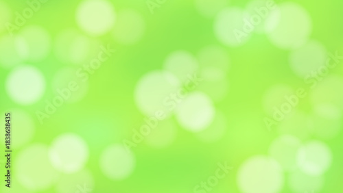 木漏れ日がまぶしい緑色の抽象的な背景(16:9)