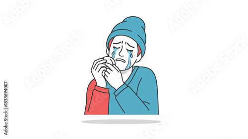 Crying person wearing a blue beanie and twotoned shirt holding a small white object